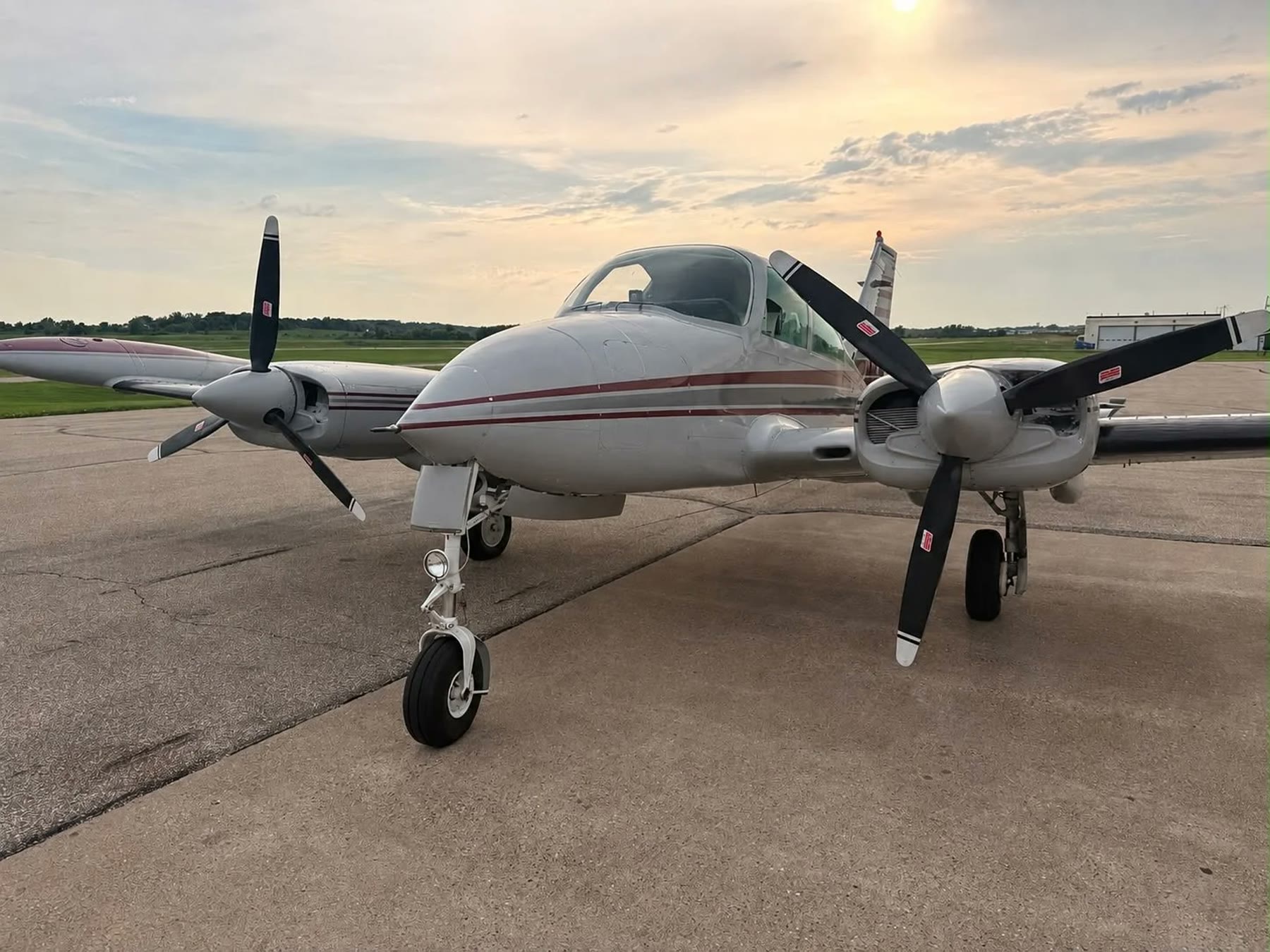 N444ST on the ramp at dusk, three quarter view from the nose